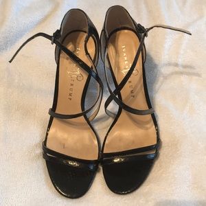 Black strappy heels by Ivanka Trump
